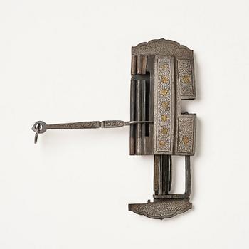 A Shokpa-shaped lock, inlaid with silver threads, Tibet, 19th century. 'Ashtamangala'.