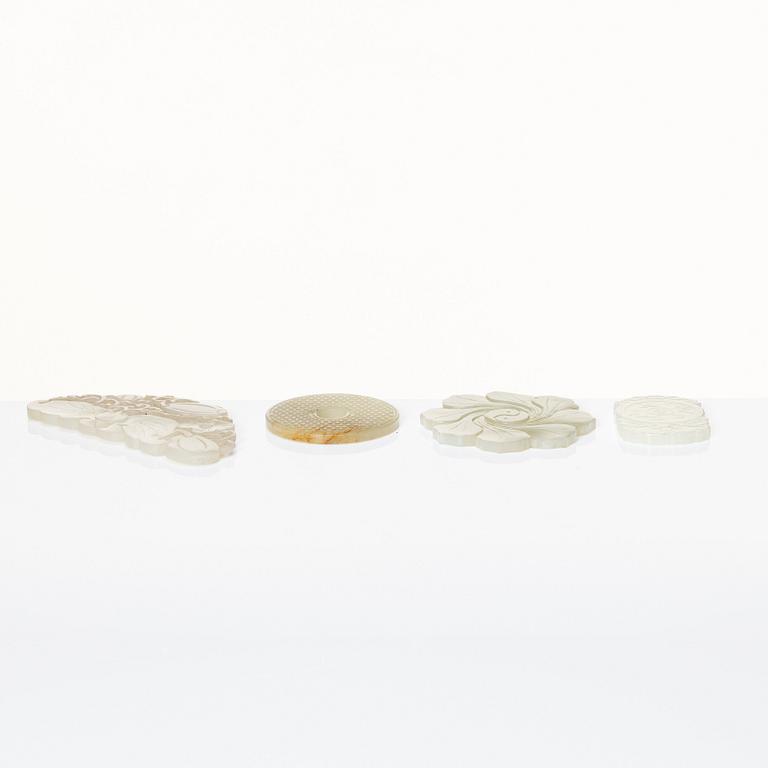 A set of four Chinese nephrite objects, 20th Century.