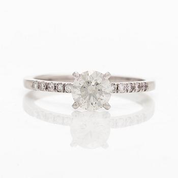 A 14K white gold ring with brilliant-cut diamonds.