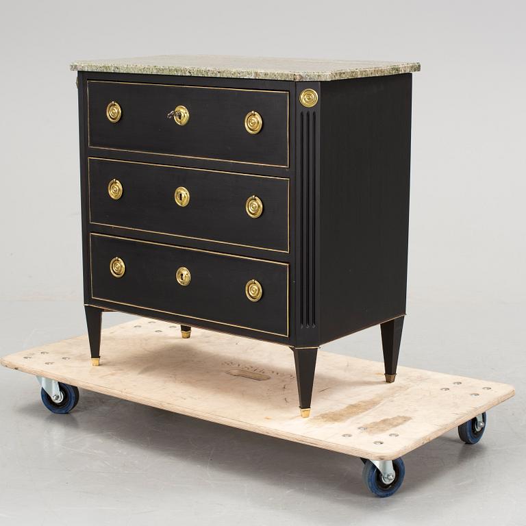 A 20th century chest of drawers.