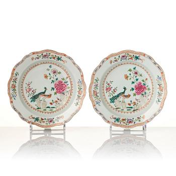 A group of famille rose 'double peacock' serving dishes, Qing dynasty, Qianlong (1736-95). (8 pieces).