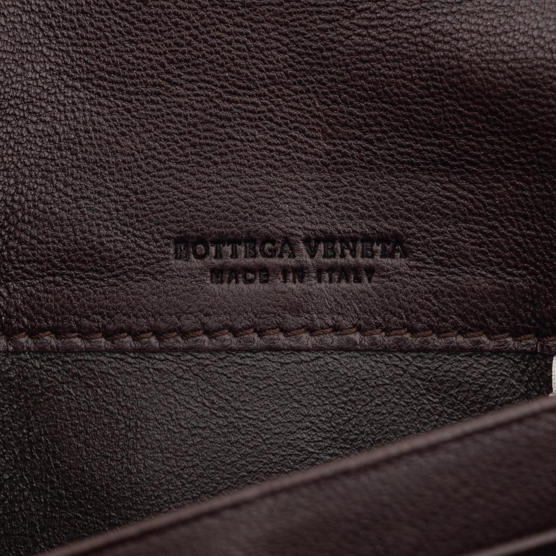 Bottega Veneta, a brown leather wallet.