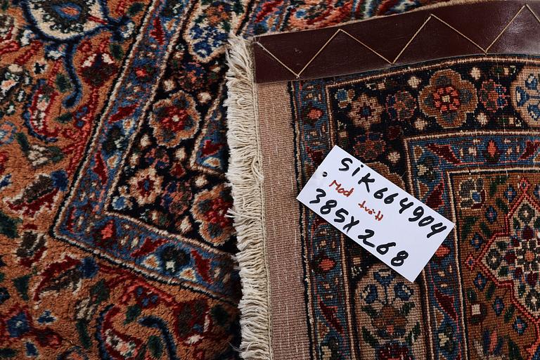 A carpet, Moud, signed, ca 385 x 268 cm.
