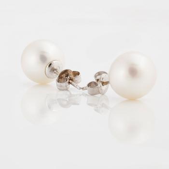 A pair of cultured pearls.