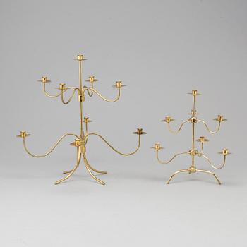 Two brass candelabra, designed by Josef Frank. Firma Svenskt Tenn.