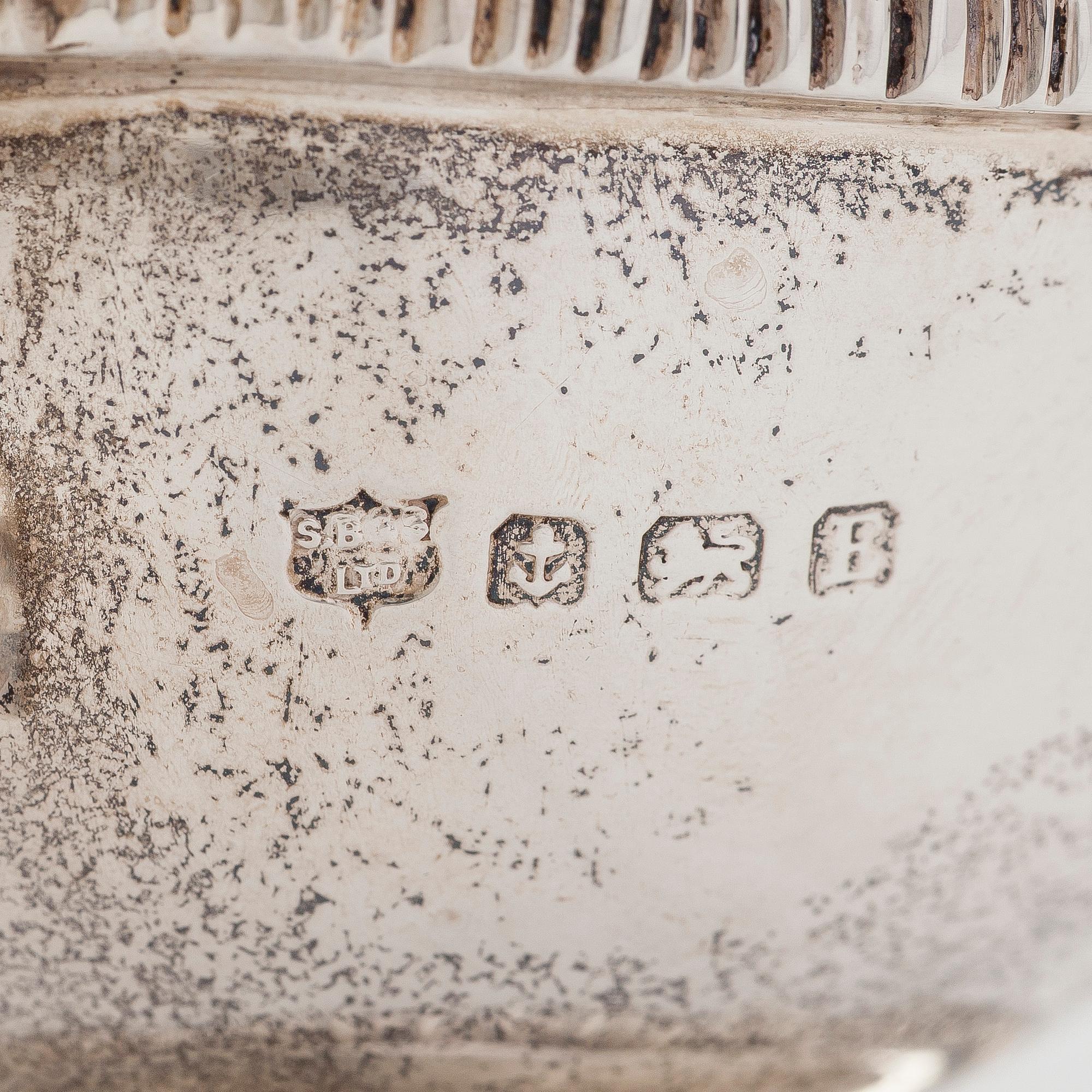 A pair of sterling silver sauce boats, maker's mark of S. Blanckensee & Son Ltd, Birmingham, England 1929.