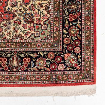 A 1960's silk Qum carpet, c. 305 x 205 cm (as well as 4 and 2 cm of flat weave on each side).