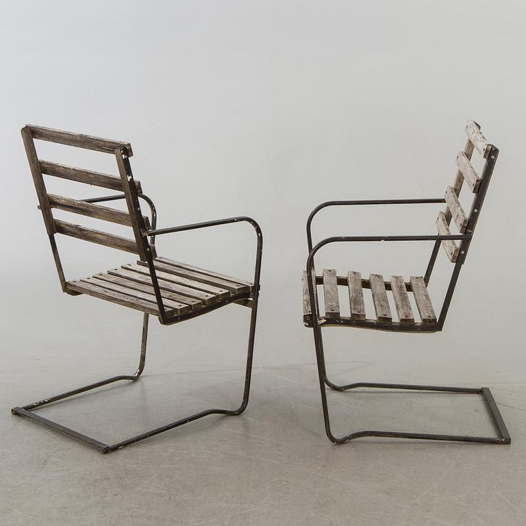 A pair of garden chairs.