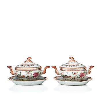 Two famille rose 'double peacock' butter tureens with covers and stands, Qing dynasty, Qianlong (1736-95).