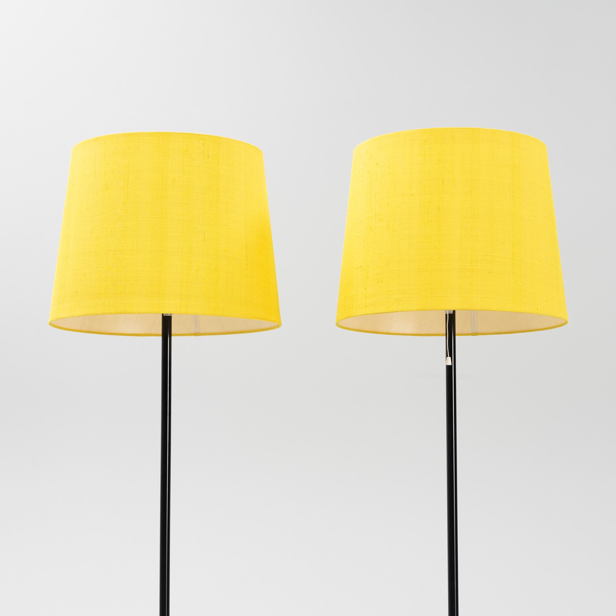 A pair of black metal floorlights, Luxus, Vittsjö.