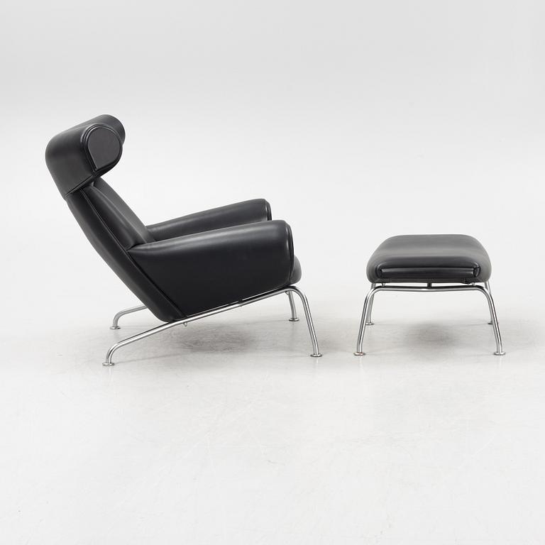 Hans J Wegner, an 'Ox Chair' and an ottoman, for Erik Jørgensen, Denmark, 2005 and 2010.