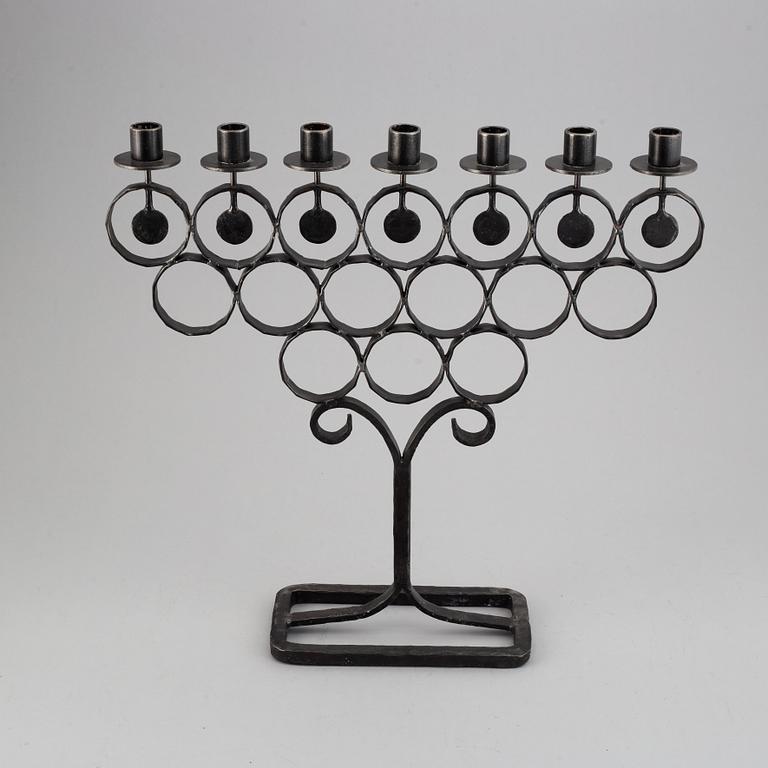 A cast iron candelabra by Bertil Vallien for Kosta Smide, Sweden.