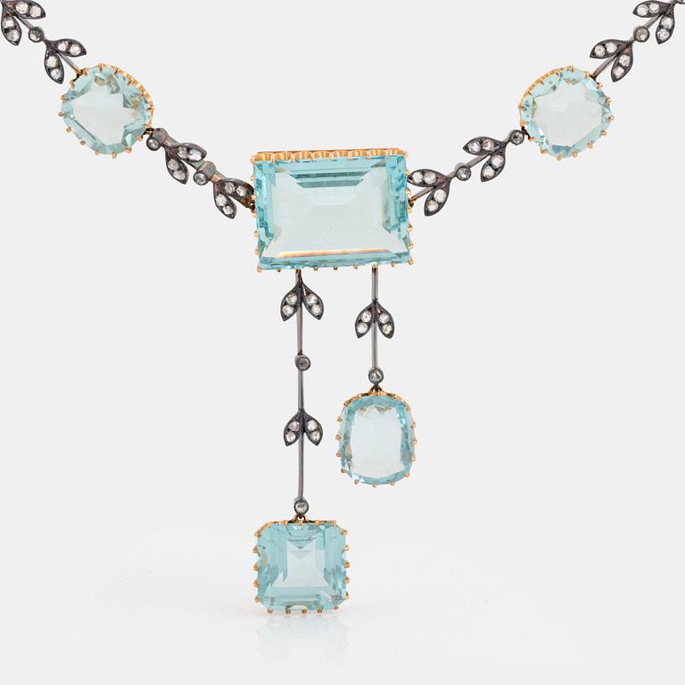 An aquamarine necklace in silver and 14K gold set with rose-cut diamonds.