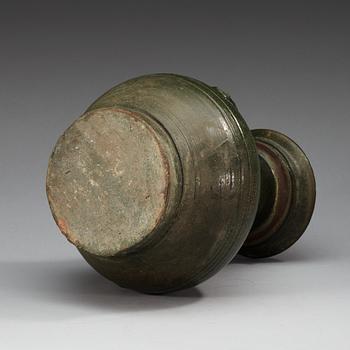A green glazed jar, Han dynasty (206 BC - 220 AD).