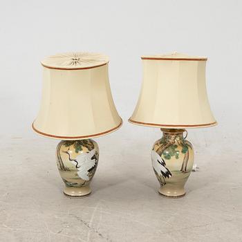 A pair of early 1900s Japanese porcelain table lamps.
