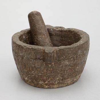 A llimestone mortar and pestle, 18th/19th Century.