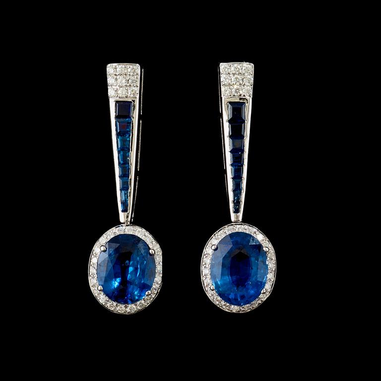 A pair of sapphire and diamond earrings. Sapphire total carat weight 5.63 cts, diamond total carat weight 0.62 ct.