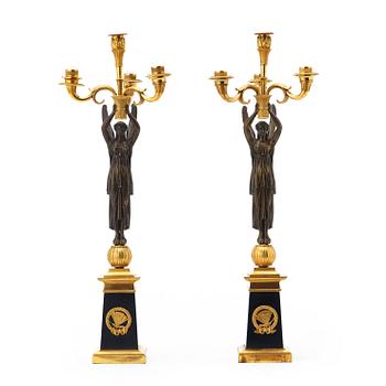 1249. A pair of French Empire early 19th century four-light candelabra.