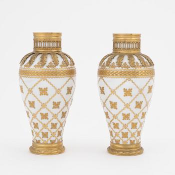 A pair of brass-mounted porcelain  vases, Sèvres mock marks, around 1900.