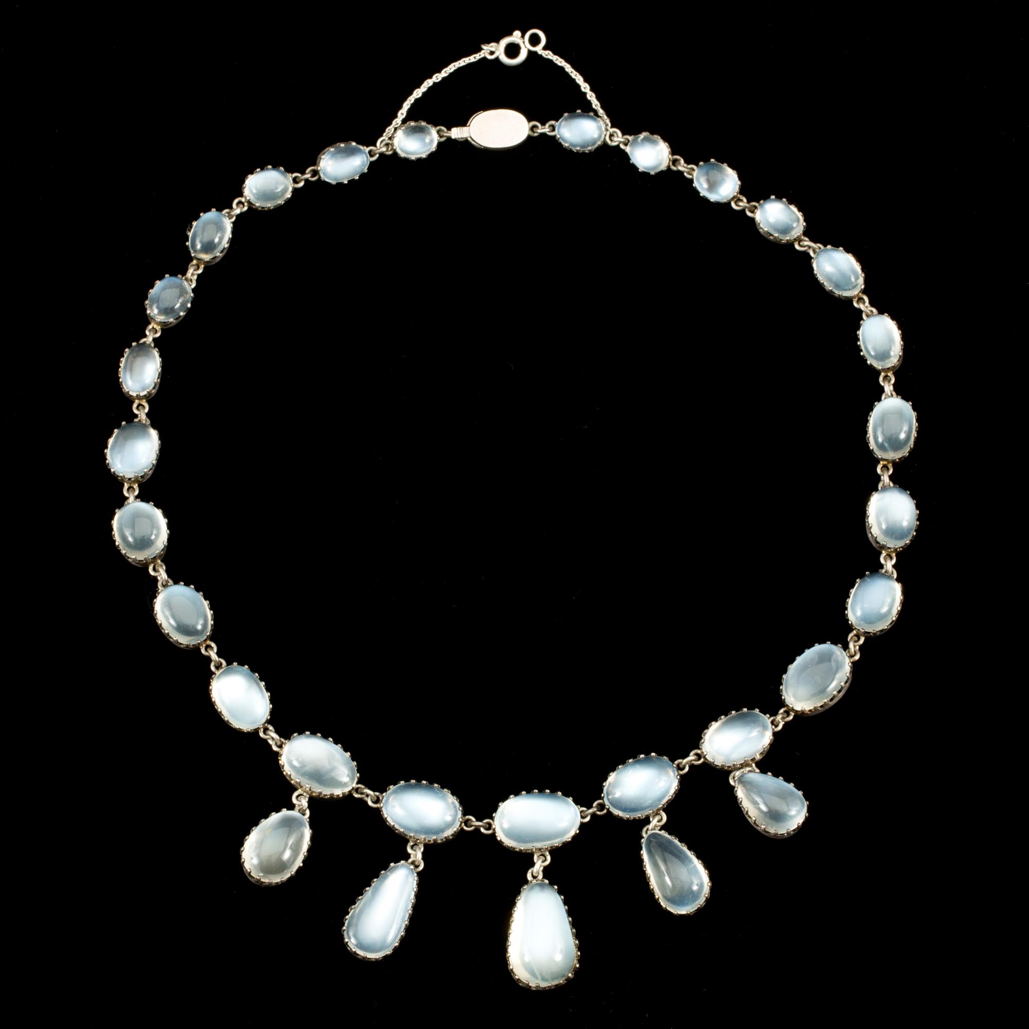 A cabochon-cut moonstone necklace. Made by C G Hallberg, Stockholm 1907.