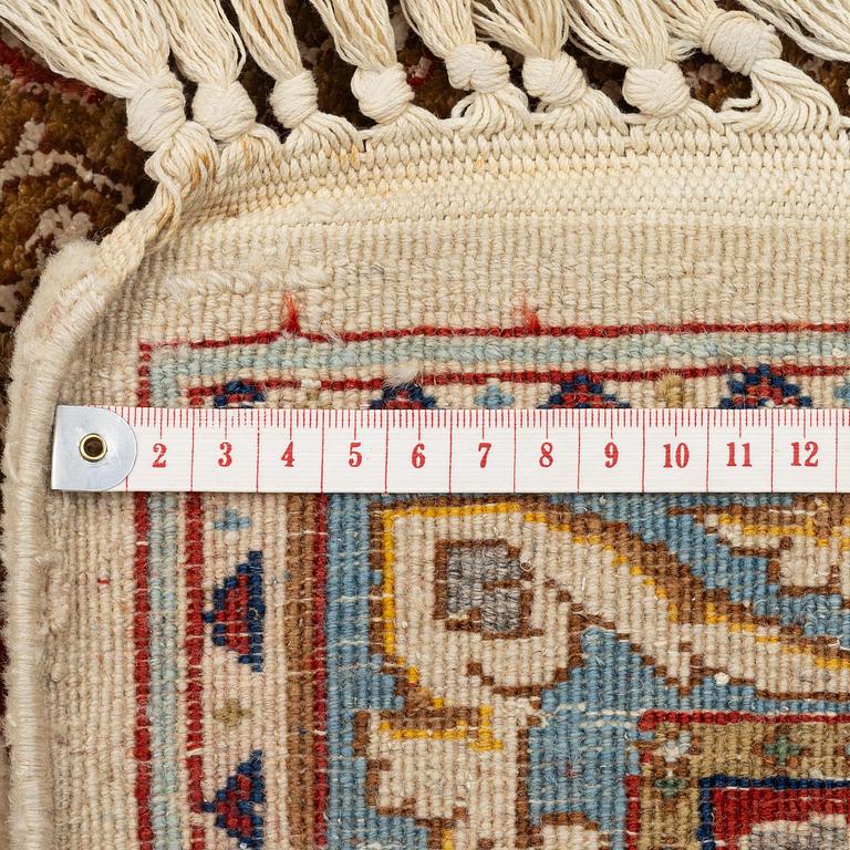 A Tabriz carpet, part silk, Northwest Persia (Iran), c. 323 x 246 cm.