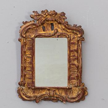 A ROCOCO WALL MIRROR.