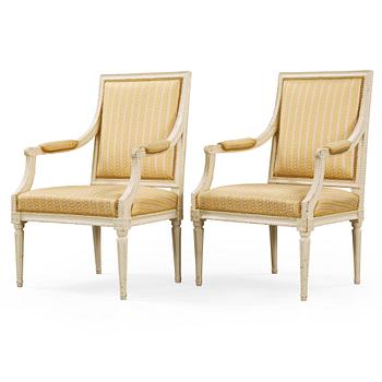 A pair of Gustavian late 18th century armchairs in the manner of Johan Lindgren.