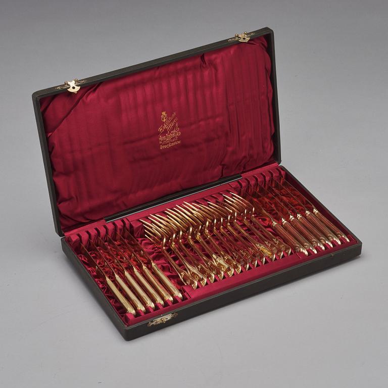 An early 19th century silver-gilt 24 piece table cutlery, mark of P Zethelius and G Folcker, Sthlm 1806 and 1826.