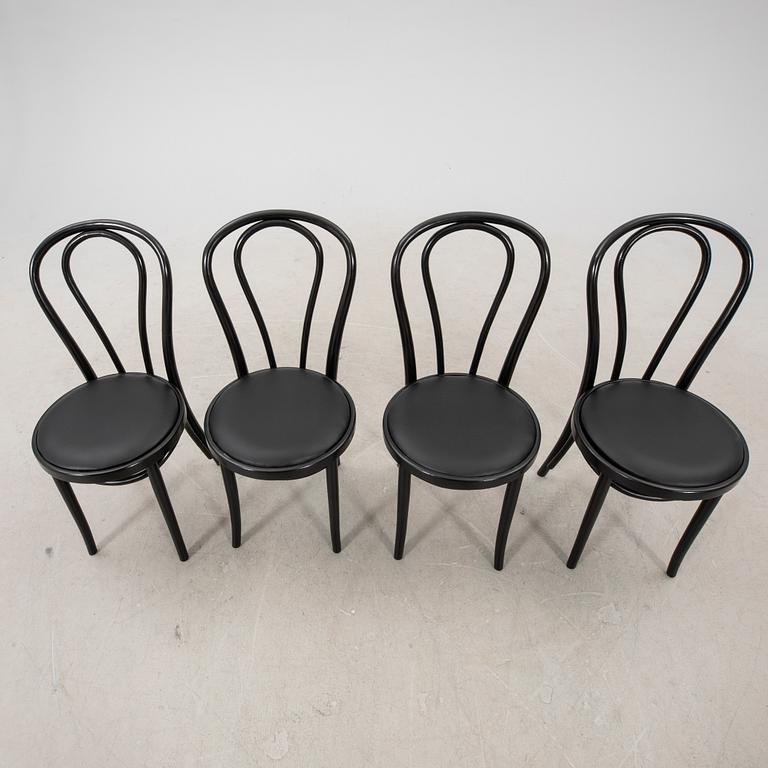 A swt of four painted chairs later part of the 20th century.