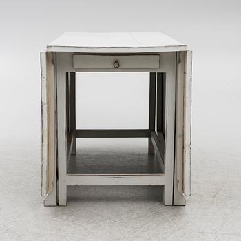 A drop-leaf table, 19th century.