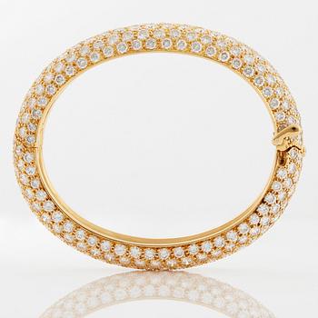 Cartier armring 18K guld med runda briljantslipade diamanter.