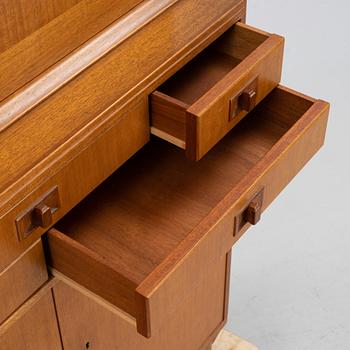 Carl Malmsten, a 'Mittens Rike' mahogany veneered cabinet, Åfors Möbelfabrik, Blomstermåla, dated 1957.