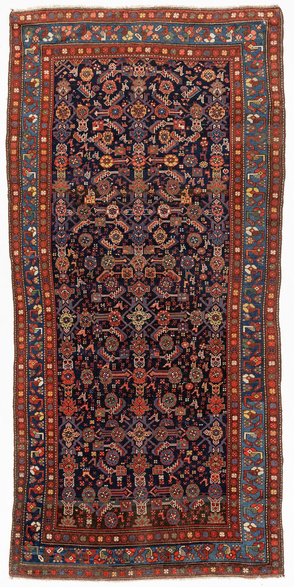A carpet, semi-antique kurdish, circa 300 x 147 cm.