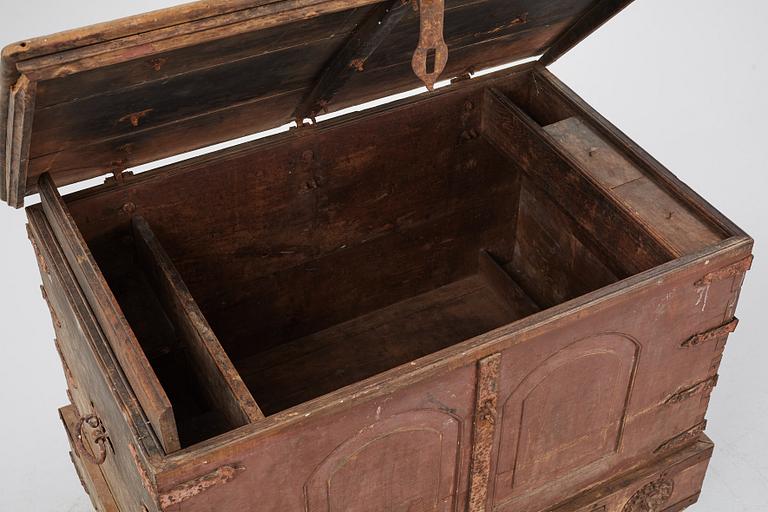 A carved oak chest with wrought iron fittings, 19th Century.