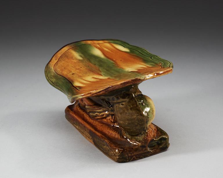 A green and yellow glazed pillow, presumably Liao dynasty (907-1125).