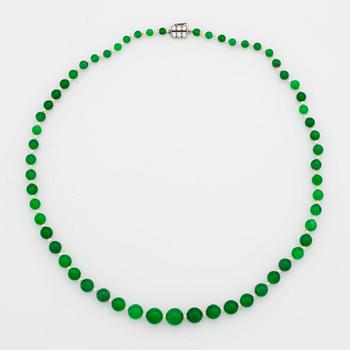 797. A NECKLACE with jadeite beads.