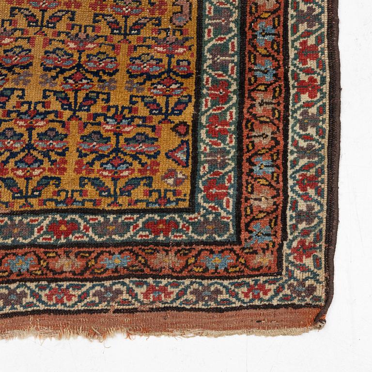 An antique Kurdish runner, c 460 x 84 cm.