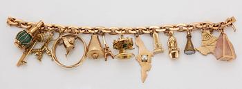 An 18K gold charm bracelet.