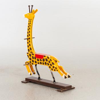 A second half of the 20th century rocking giraffe.