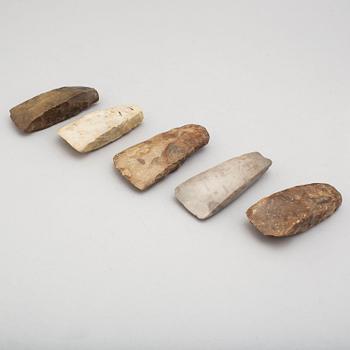 Five neolithic flint axes.