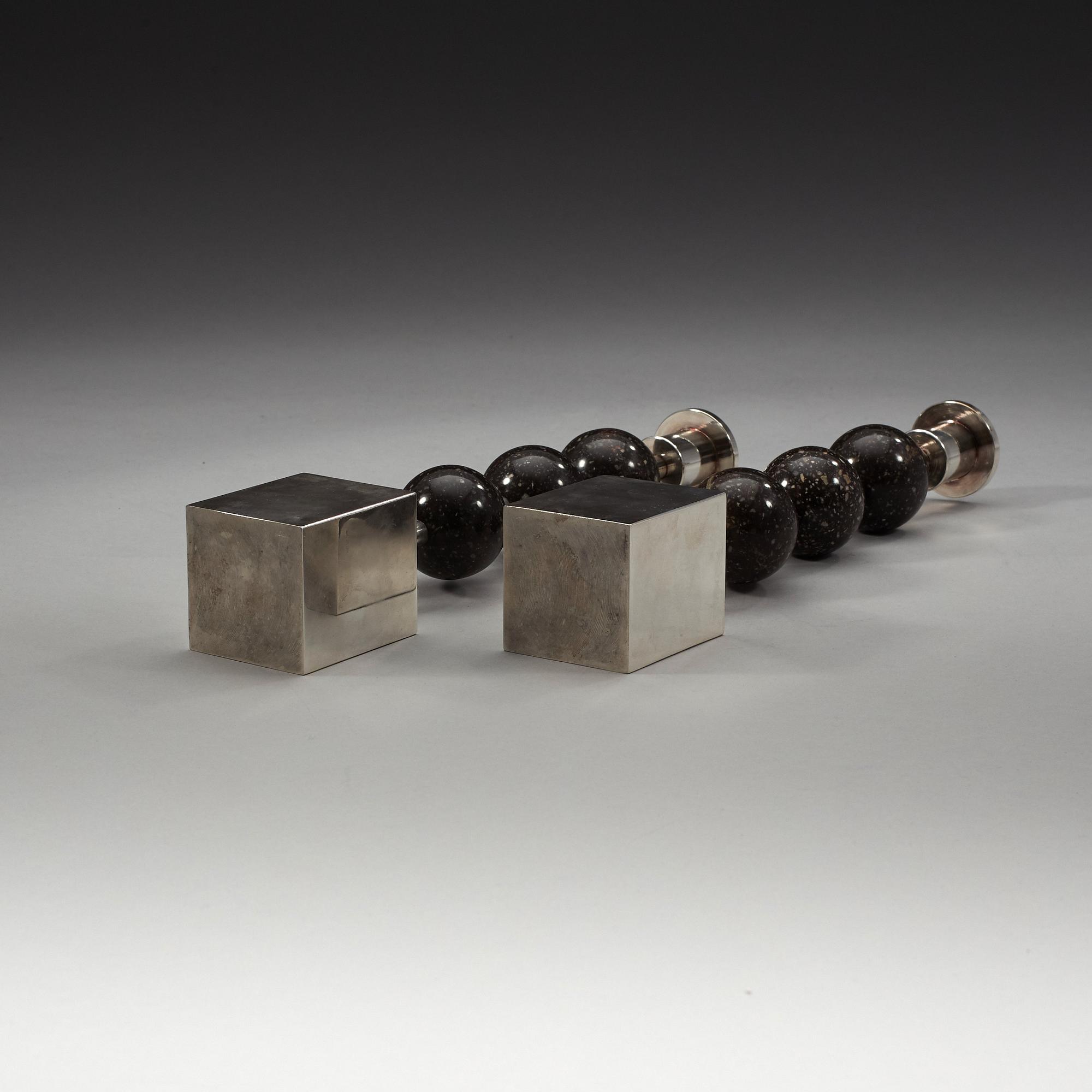 Sigurd Persson, a pair of silver plated and porphyry candlesticks, Sweden.