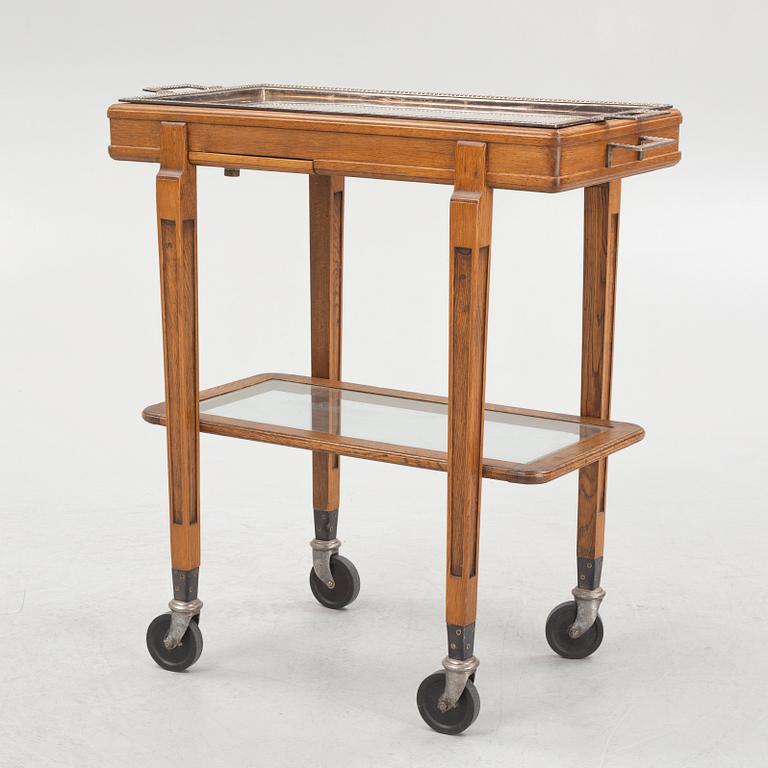 A restaurant serving trolley with silver plate dishes, first half of the/mid 20th century.