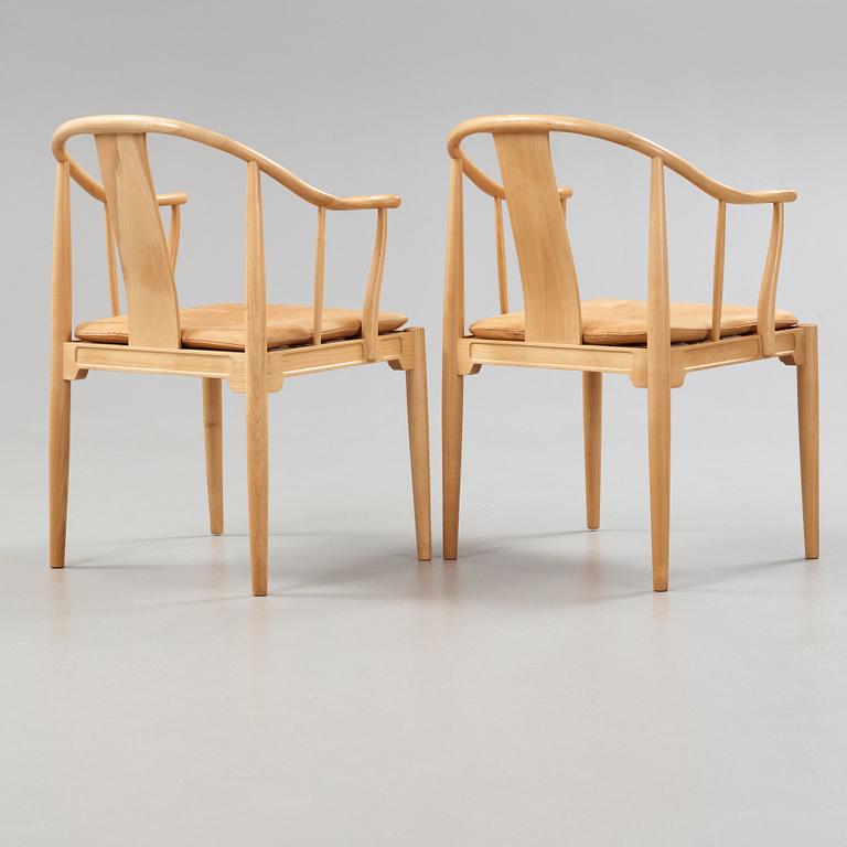 A pair of Hans J Wegner 'China chairs', Fritz Hansen, Denmark 1986-87.