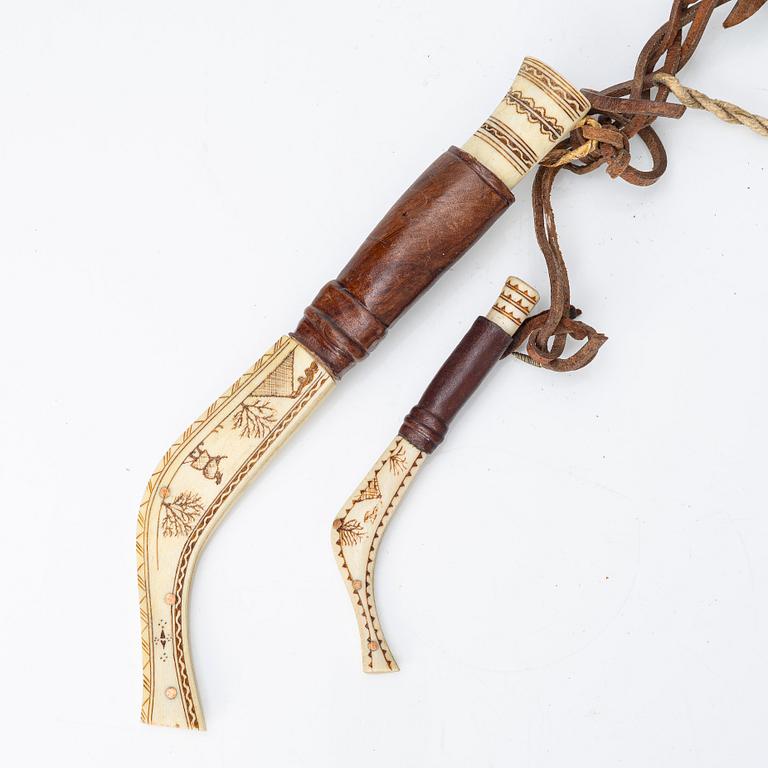 Half-horn knives, cup, bottle, needle case.