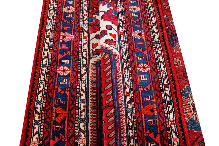 An oriental carpet, c. 230 x 151 cm.