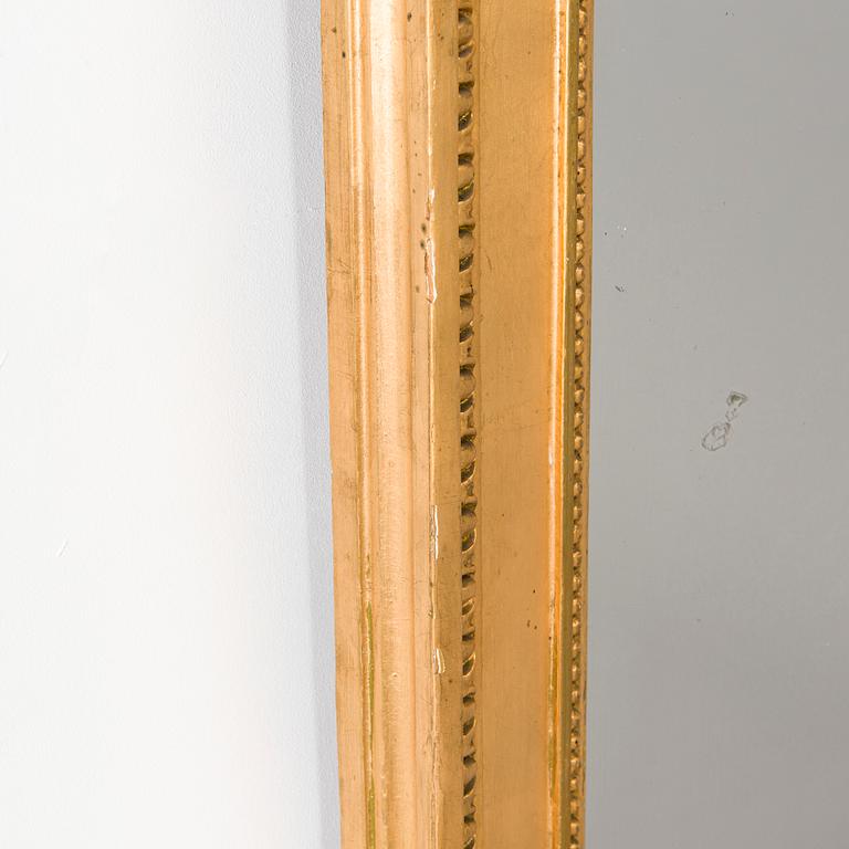 An Empire mirror, first half of the 19th century.