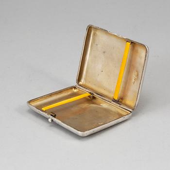 A Russian parcel-gilt silver and niello cigarette-case, import marks 1882-98.