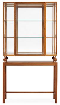 451. A Josef Frank walnut show case cabinet on stand,