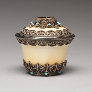 A bejewelled tibetan silver and turkoise bowl with cover, 19th Century.