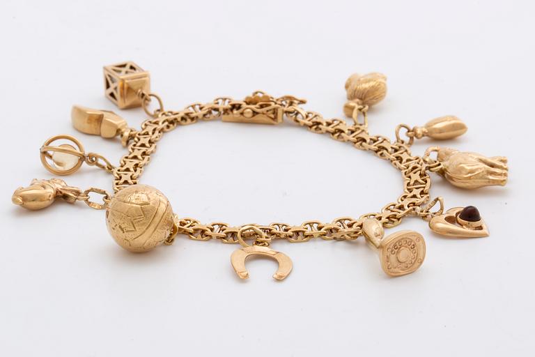 ARMBAND 18K guld berlocker 20,9 g, Stockholm 1958.
